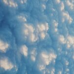 Fluffy white clouds seen from above on a clear day